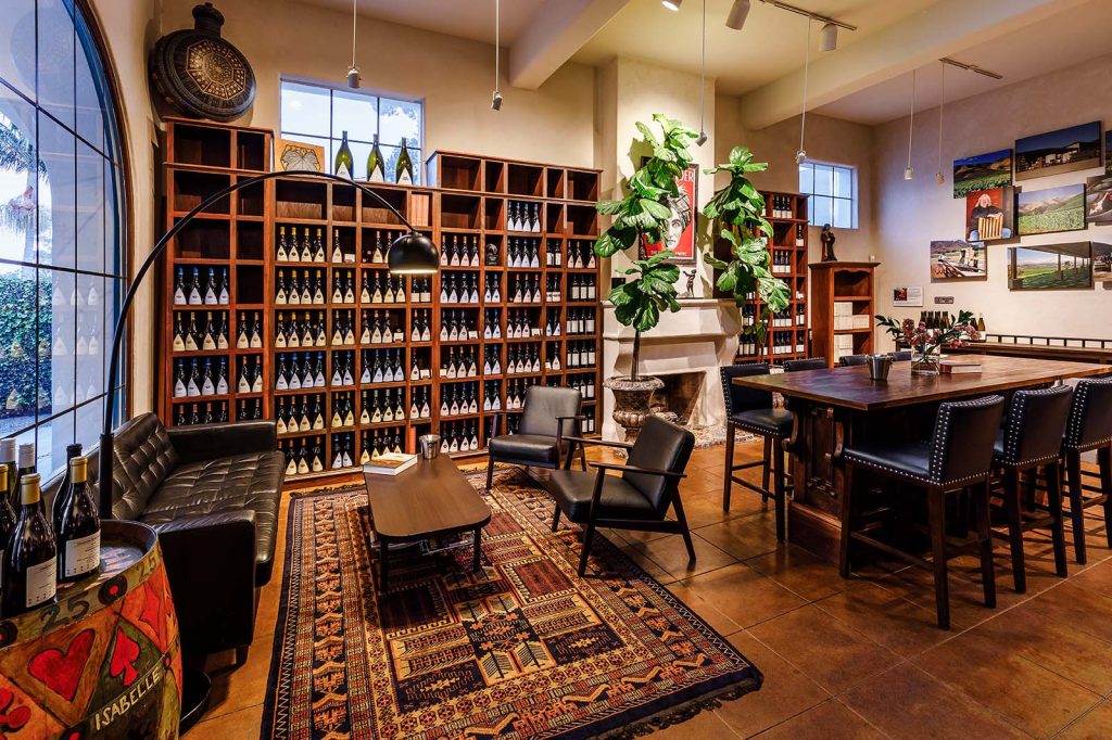 A view of our Library Wines Wall in our warm and inviting Santa Barbara Wine Tasting Room for Au Bon Climat and Clendenen Family Vineyards